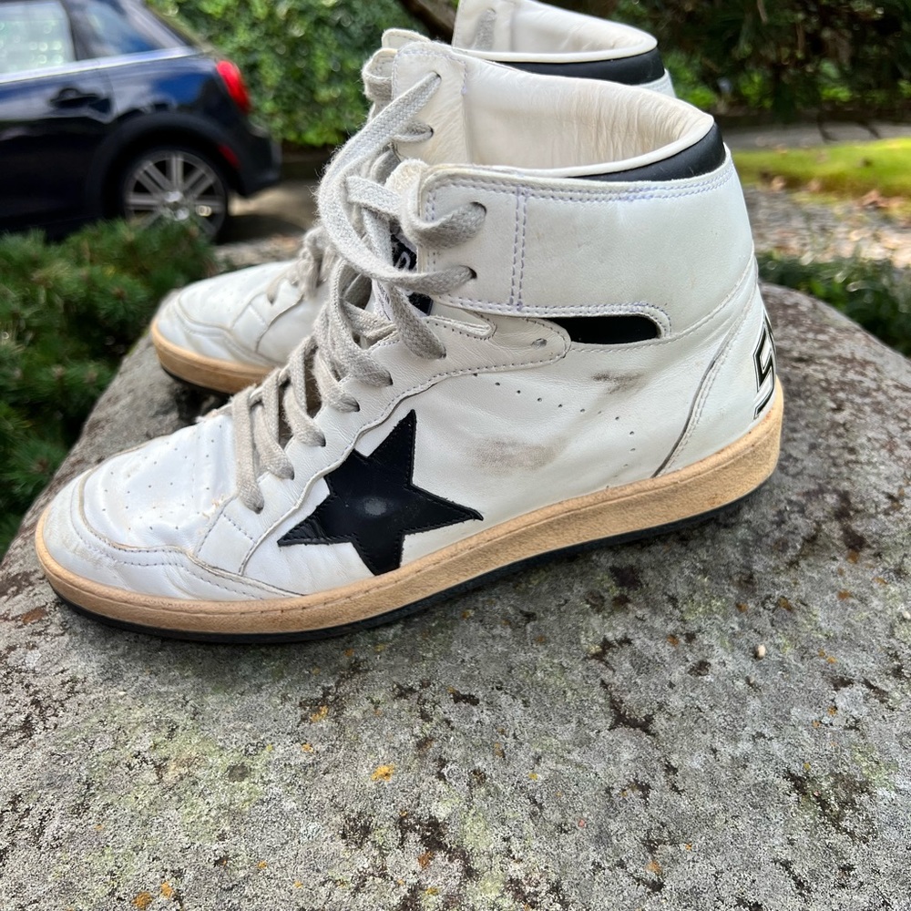 Golden Goose Sky-Star hi top sneakers with signature on the ankle.